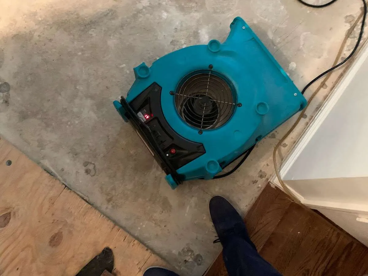 Air mover drying subfloor during Leak Detection & Repair in Tallmadge
